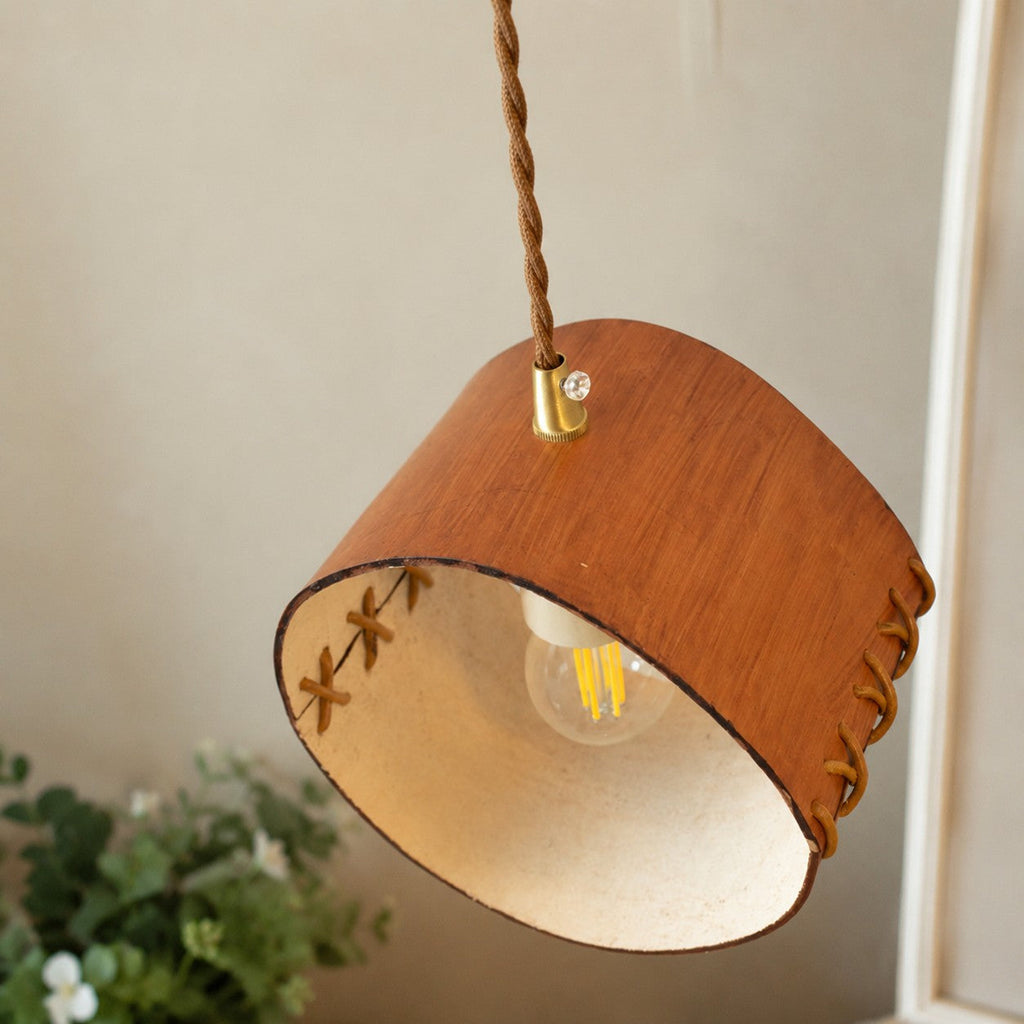 Cylinder Pendant Light — Hand-Laced Leather, Compact Silhouette, Warm Interior Shade