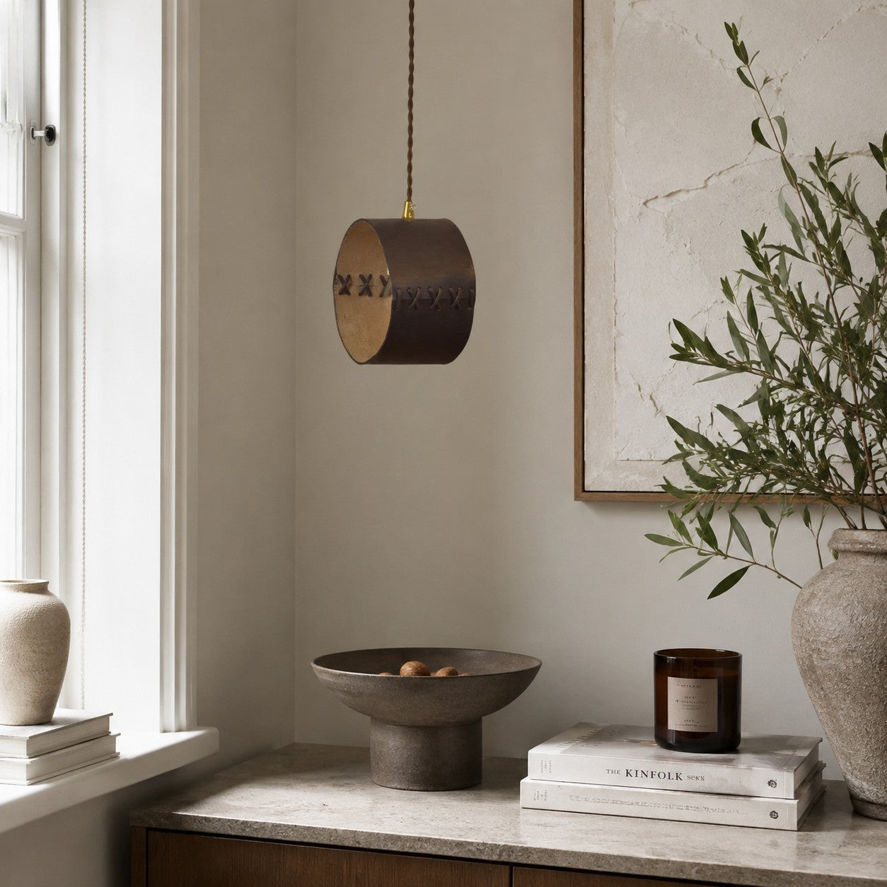 Cylinder Pendant Light — Hand-Laced Leather, Compact Silhouette, Warm Interior Shade